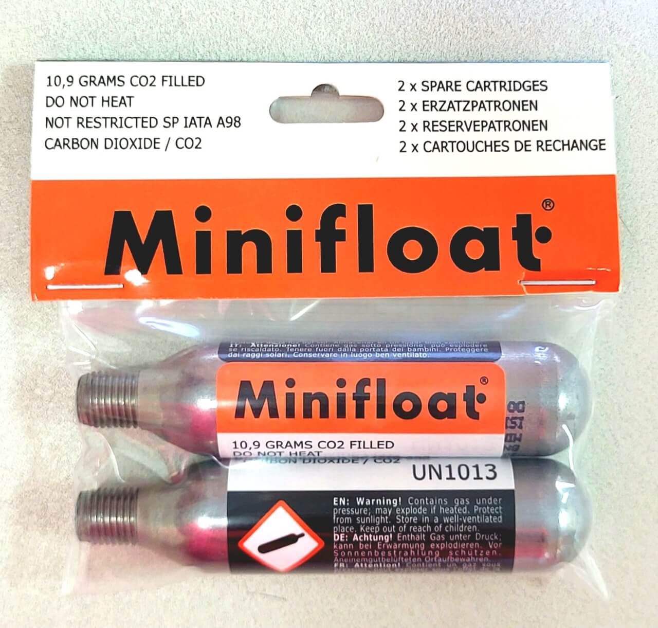 Minifloat CO2 cartridges in packaging with branding and product details.